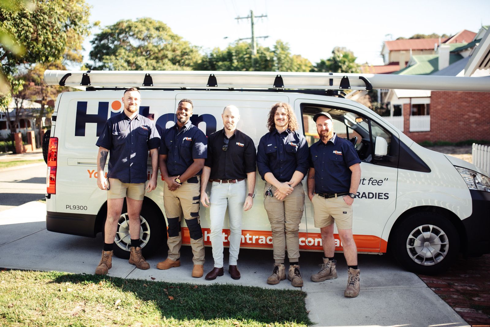 Joondanna plumbers posing in front of the van