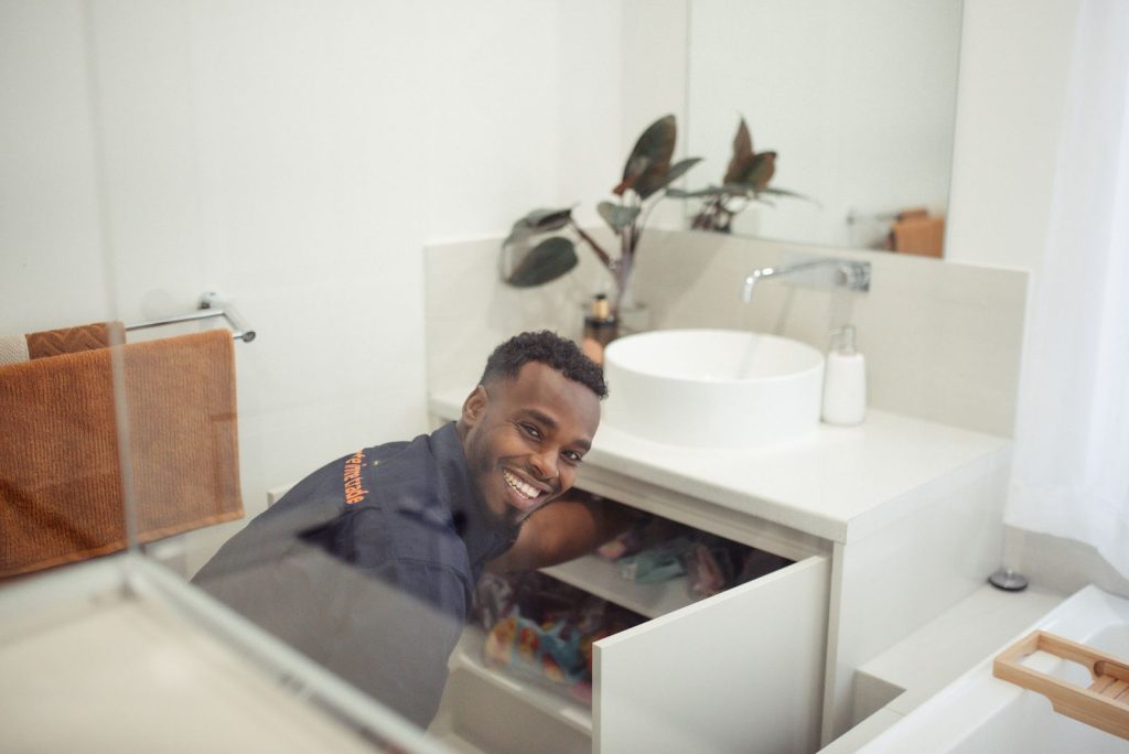 Paulls Valley Plumber fixing a sink