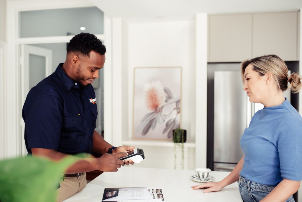 The Vines plumber helping a woman